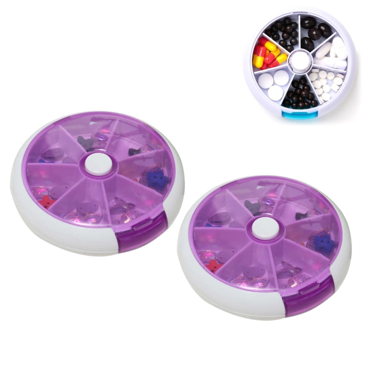 Purple rotating plastic pill box with seven grid compartments, lid open