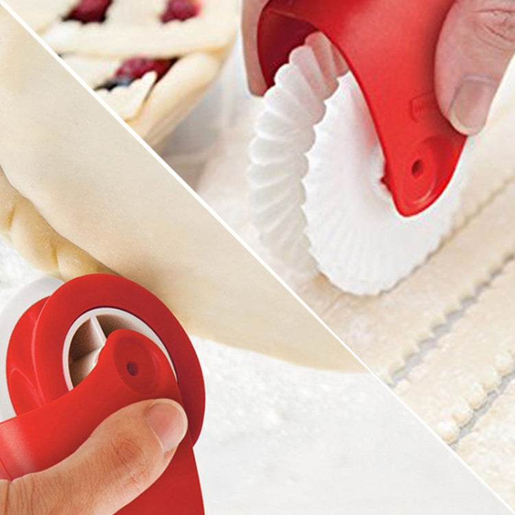 Red pasta cutting wheel with white roller creating ridged dough lines