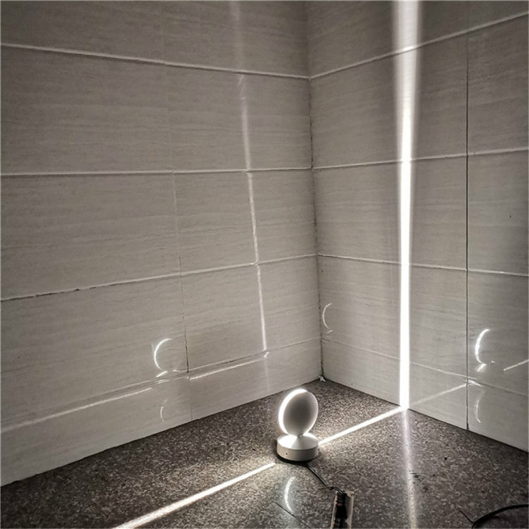 LED wall spotlight with semicircle head glowing white light in corner