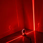 LED wall spotlight with semicircle head glowing red light in corner