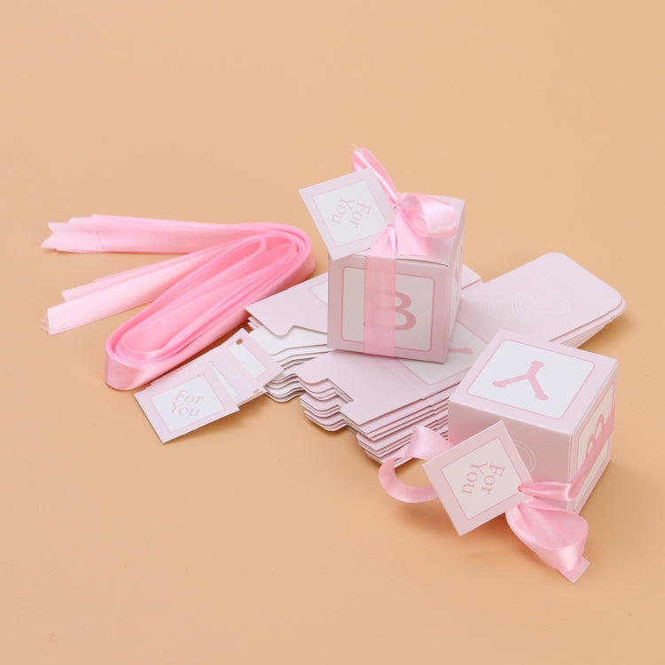 Pink candy favor boxes and ribbon ties with 'For You' cards, showing B and Y icons
