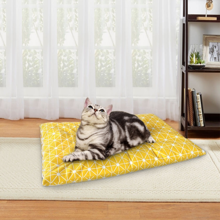 Yellow geometric pet sleeping mat with tabby cat lying down