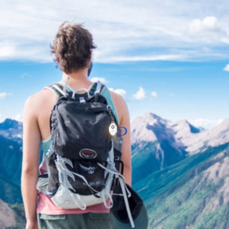 Camping hiker with backpack on trail in mountains