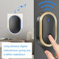 Wall-mounted oval smart doorbell receiver with blue light, fingertip pressing the button