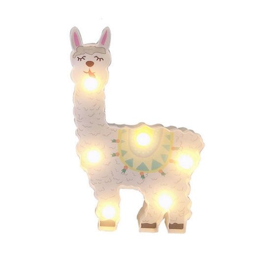 Alpaca-shaped LED night light, white body with glowing eyes and feet