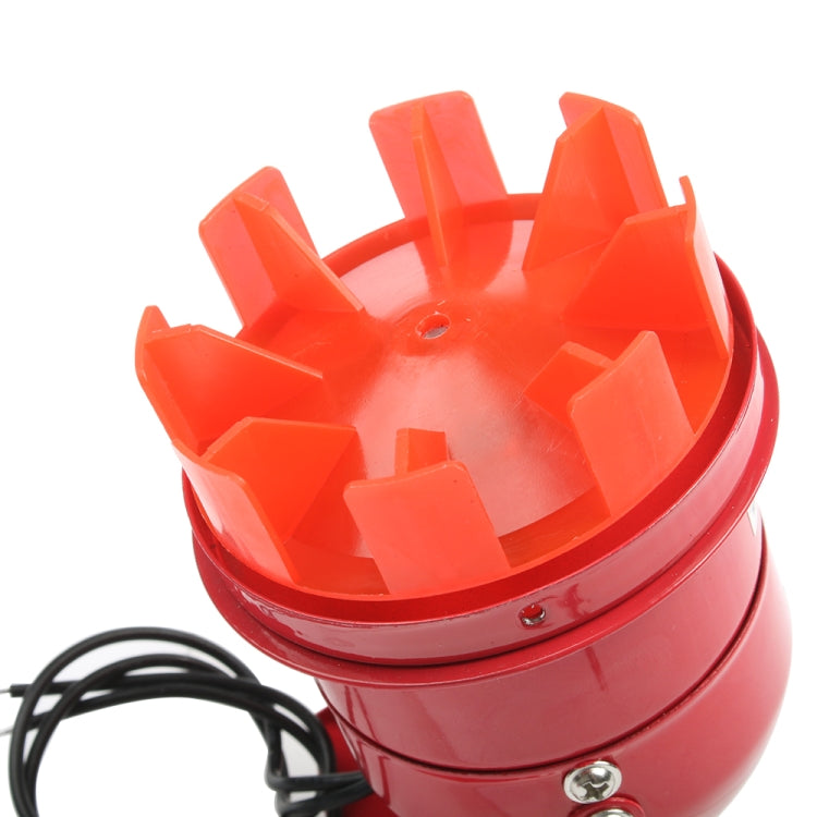Red alarm buzzer horn grille close-up with vented dome and screw holes