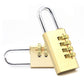Brass four-digit code padlock with open shackle and combination dial panel