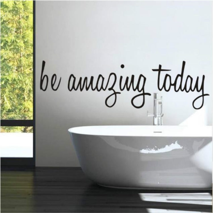 Removable wall sticker with cursive text "be amazing today" applied to wall