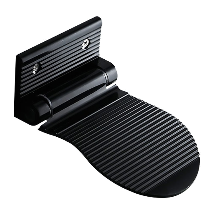 Black wall-mounted shower foot rest with ribbed non-slip folding design