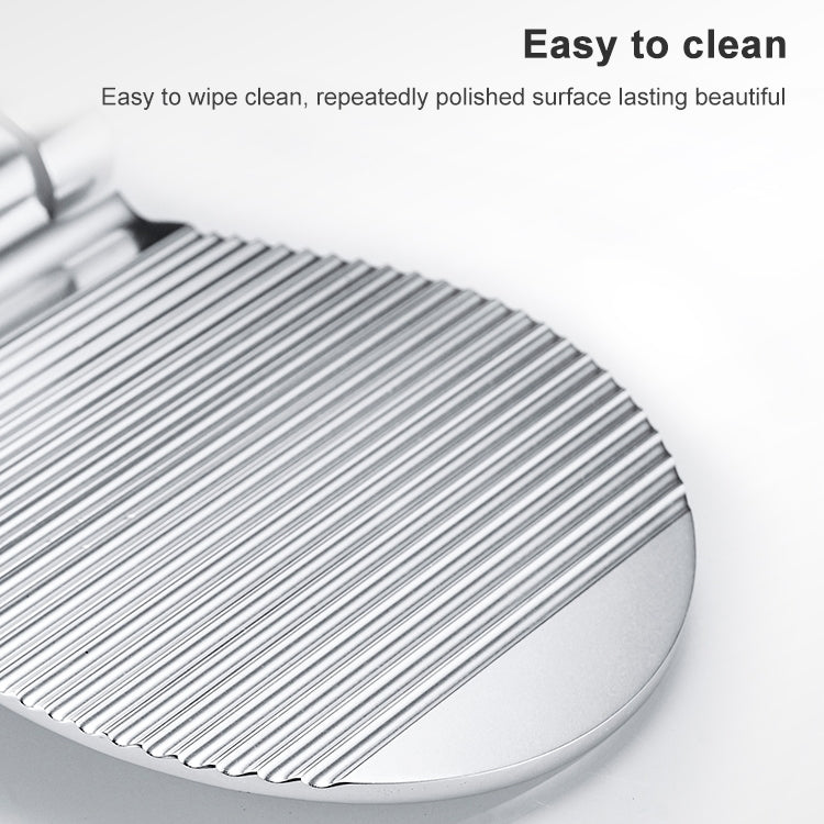 Silver shower foot rest with ribbed tread and rounded edge