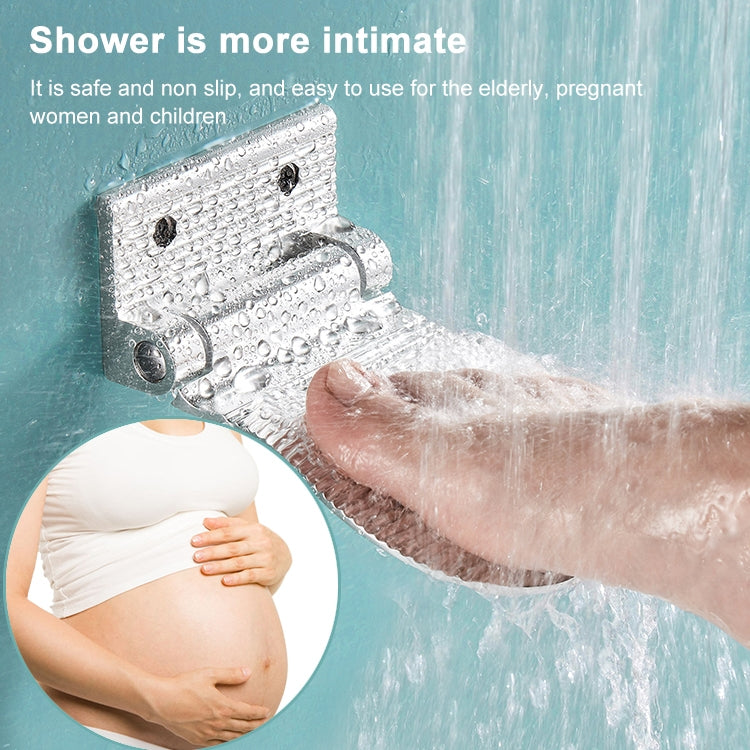 Silver wall-mounted shower foot rest with textured anti-slip surface