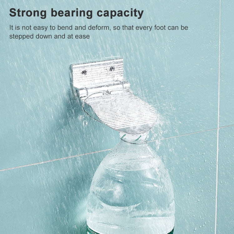 Silver wall-mounted shower foot rest with ribbed tread and wide rounded end