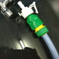 Green and yellow quick-connect garden water joint attached to hose fitting