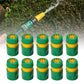 Set of green garden water connection joints with yellow top rings and open center ports