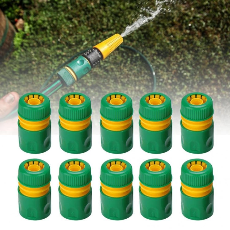 Set of green garden water connection joints with yellow top rings and open center ports