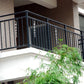 Reflective rotating rods with chrome spirals on a balcony railing