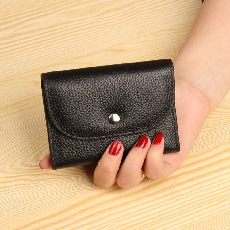 Black pebbled leather card wallet with front flap and metal snap button