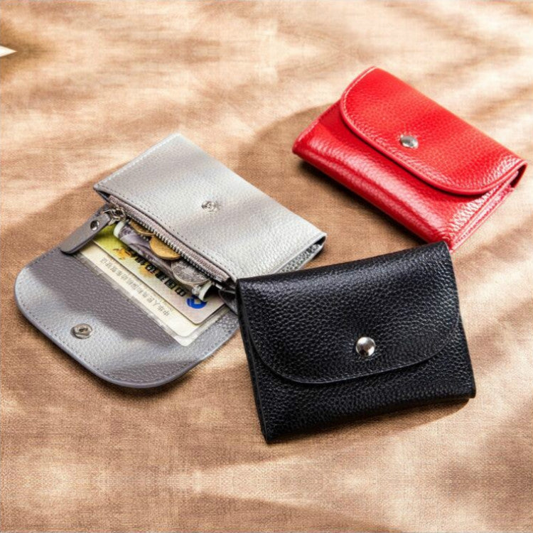 Pebbled leather card wallets with snap flaps in gray, red, and black