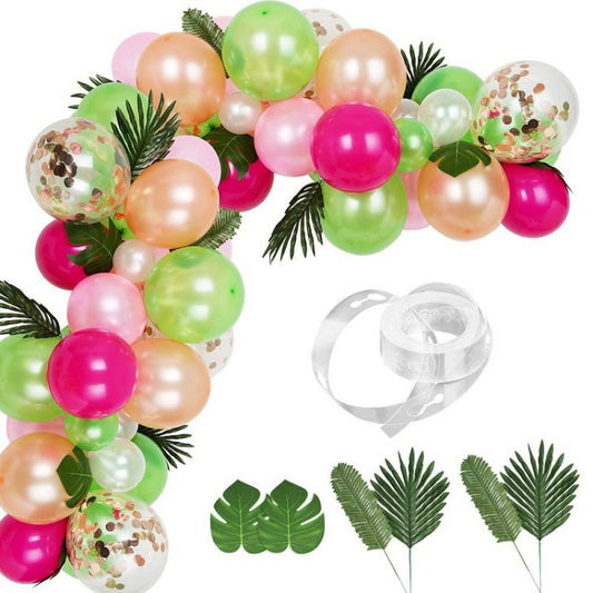 Tropical balloon garland set with pink, green, gold, and clear balloons plus leaf accents