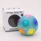 Luminous blue fidget ball toy beside retail box, with pink top dome and side ports