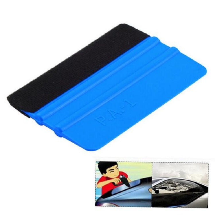 Blue plastic film scraper with black felt strip on top, flat handheld cleaning tool