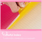 Hand inserting a colored index tab into a loose-leaf binder notebook
