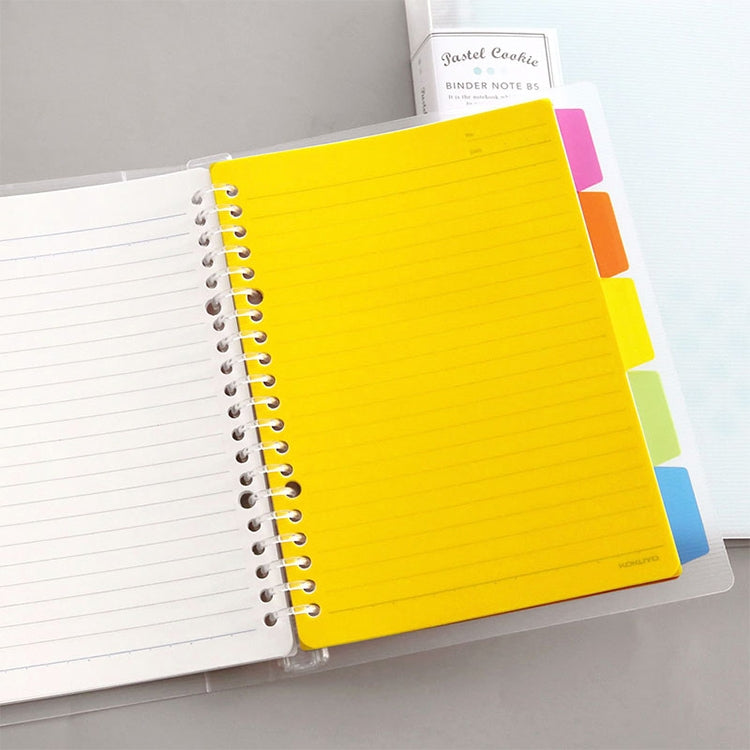A5 yellow loose-leaf binder notebook open with lined pages and metal ring binding