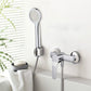 Chrome handheld shower head on flexible hose near wall-mounted faucet
