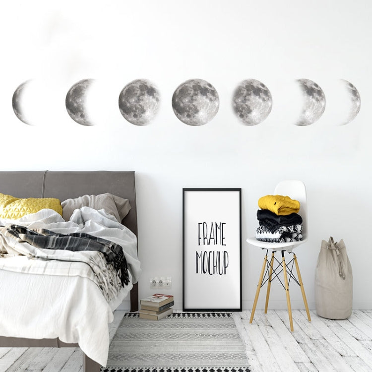 Silver moon phase wall decals with cratered crescents and full moons across the wall.