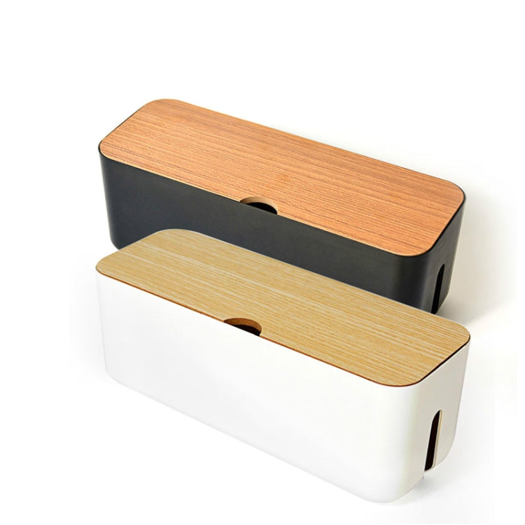 Stacked cable storage boxes, black and white, with wood-look lids and side slots