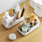 White plastic makeup organizer set with divided trays for brushes, bottles, and skincare items