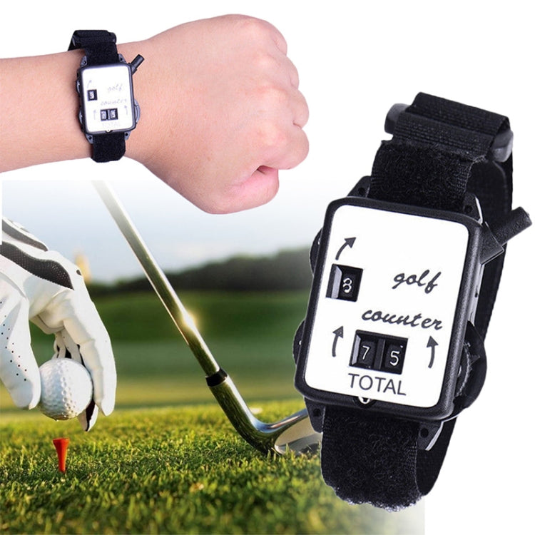Portable golf counter watch worn on wrist with black strap and square counter display