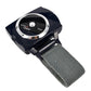 Anti-snoring wrist device with gray fabric strap and round test panel