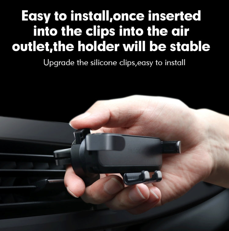 Car air vent phone holder being installed on a dashboard air outlet clip