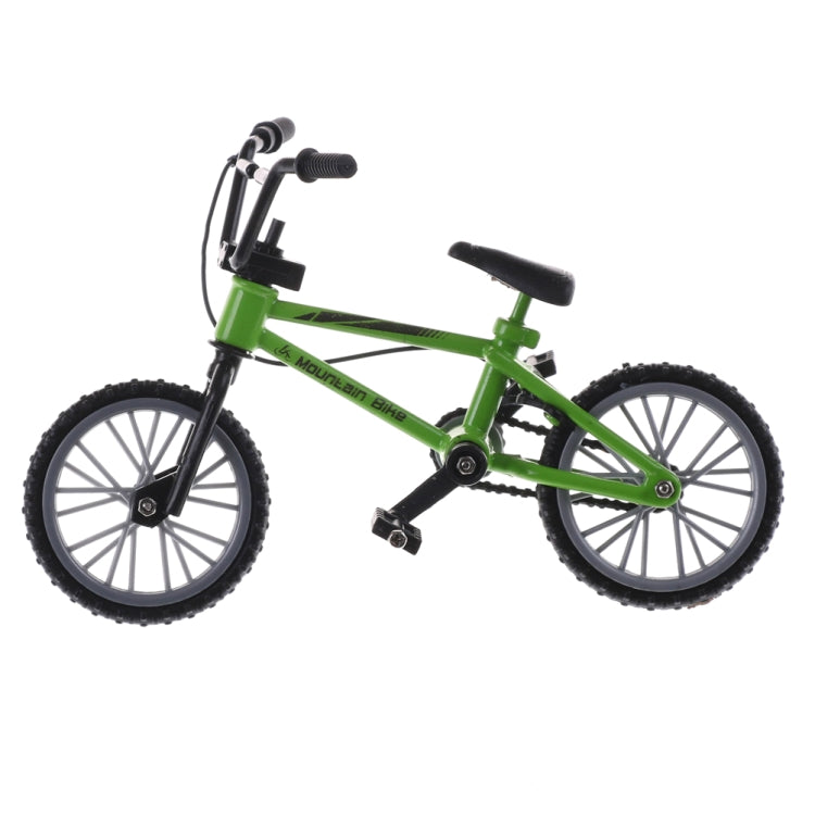 Green mini kids finger bike toy with black handlebars and treaded tires