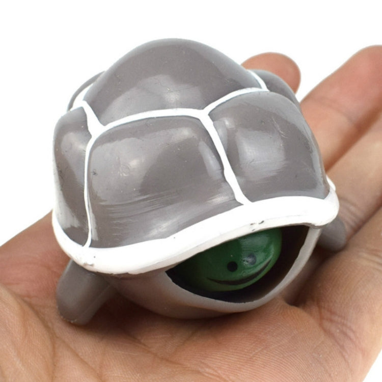 Telescopic turtle squeeze toy with gray shell and green eye peeking out