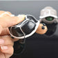 Telescopic turtle squeeze toy with black-and-white shell and orange head peeking out
