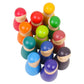 Close view of 12 rainbow wooden peg dolls, light wood necks and vibrant painted bodies