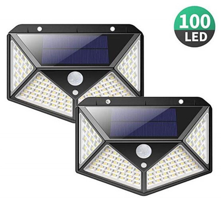 Set of two outdoor solar wall lights with black housings, LED panels, and motion sensor