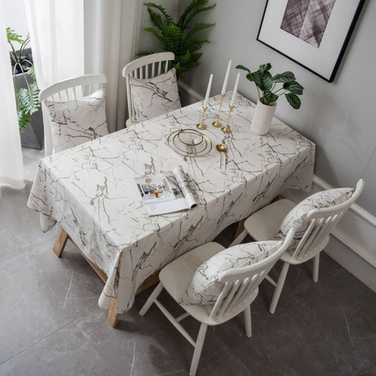 White marble-pattern cotton-linen tablecloth with black veining, draped over a round dining table
