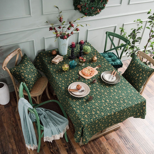 Green linen-cotton Christmas tablecloth with small gold snowflake pattern