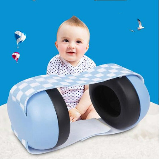 Newborn baby wearing light blue earmuffs with black ear pads and check-pattern headband