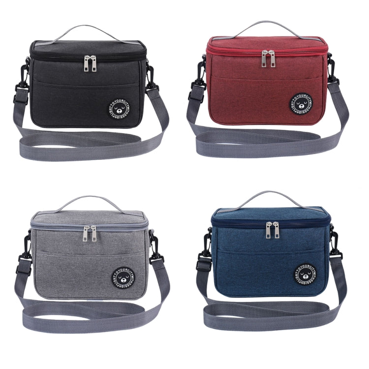 Insulated lunch cooler bags in black, red, gray, and blue with shoulder straps and front zippers