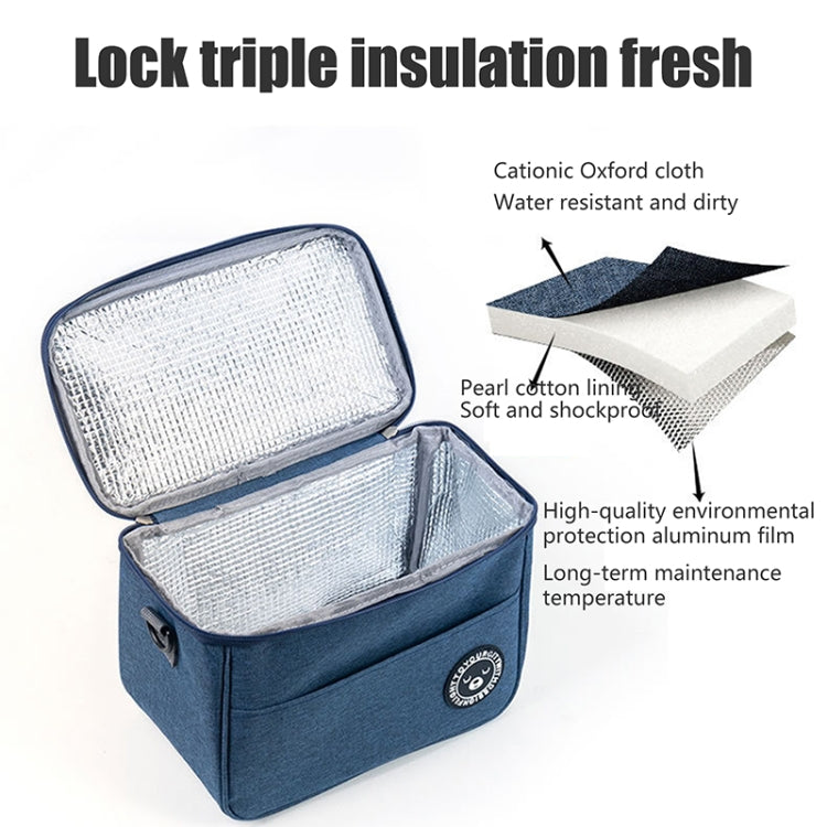 Open blue insulated lunch cooler bag with reflective liner and padded interior, front zipper closure