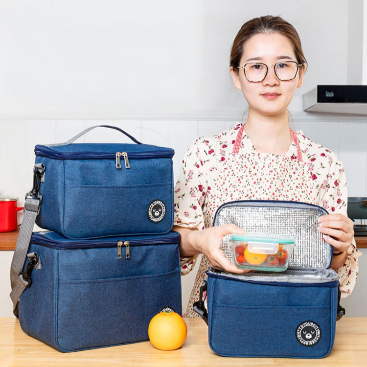 Blue insulated lunch cooler bags, one open with reflective lining, with shoulder straps