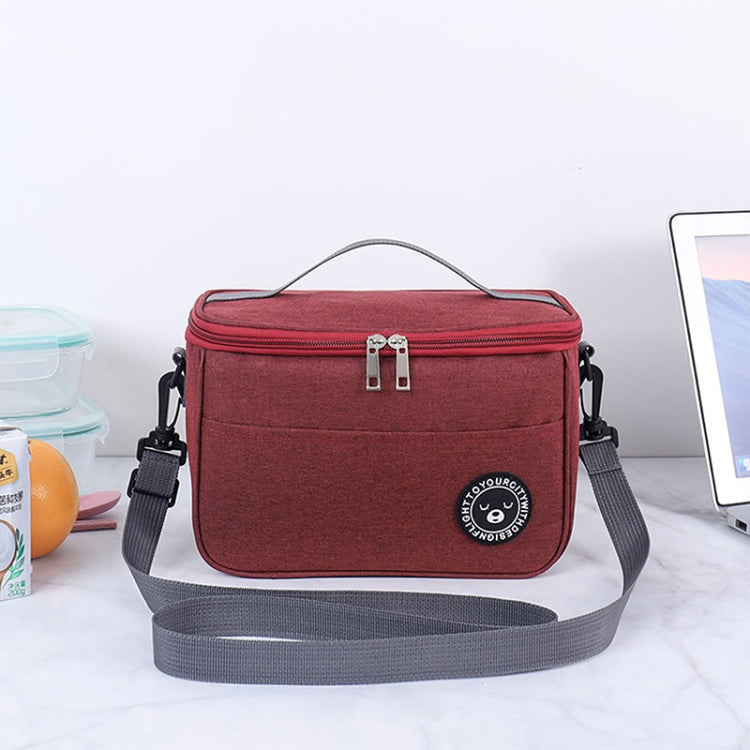 Maroon insulated lunch cooler bag with top handle, front zipper, and adjustable shoulder strap