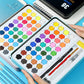 Open watercolor paint tray with multicolor hex pans and included brushes