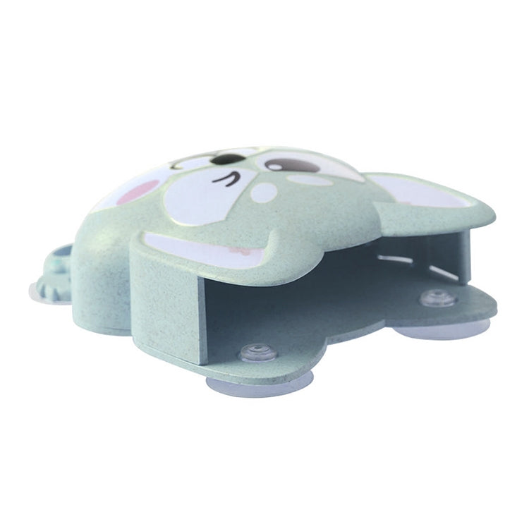 Light blue cartoon dog suction toothbrush holder with dual compartments, side view.