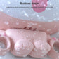 Pink waterproof toothbrush holder base with droplets and drainage opening.