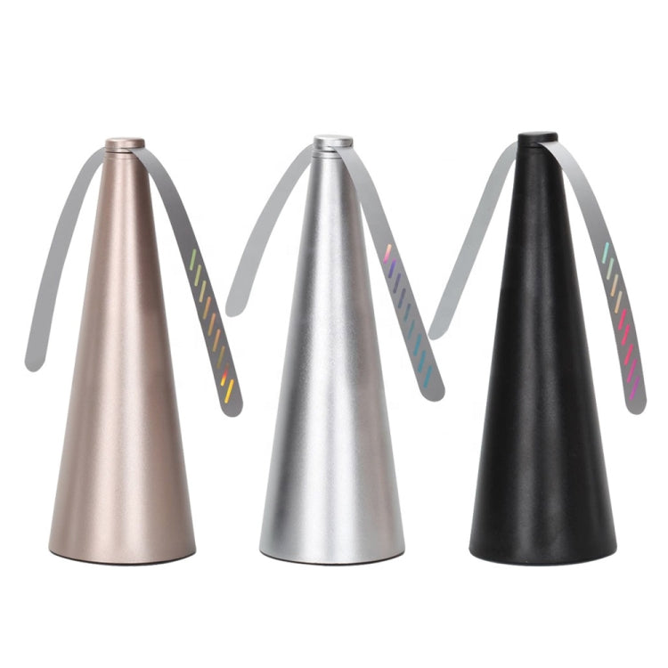 Three cone-shaped fly catcher fans in gold, silver, and black